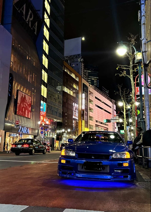Modified JDM car photographed at night in Tokyo