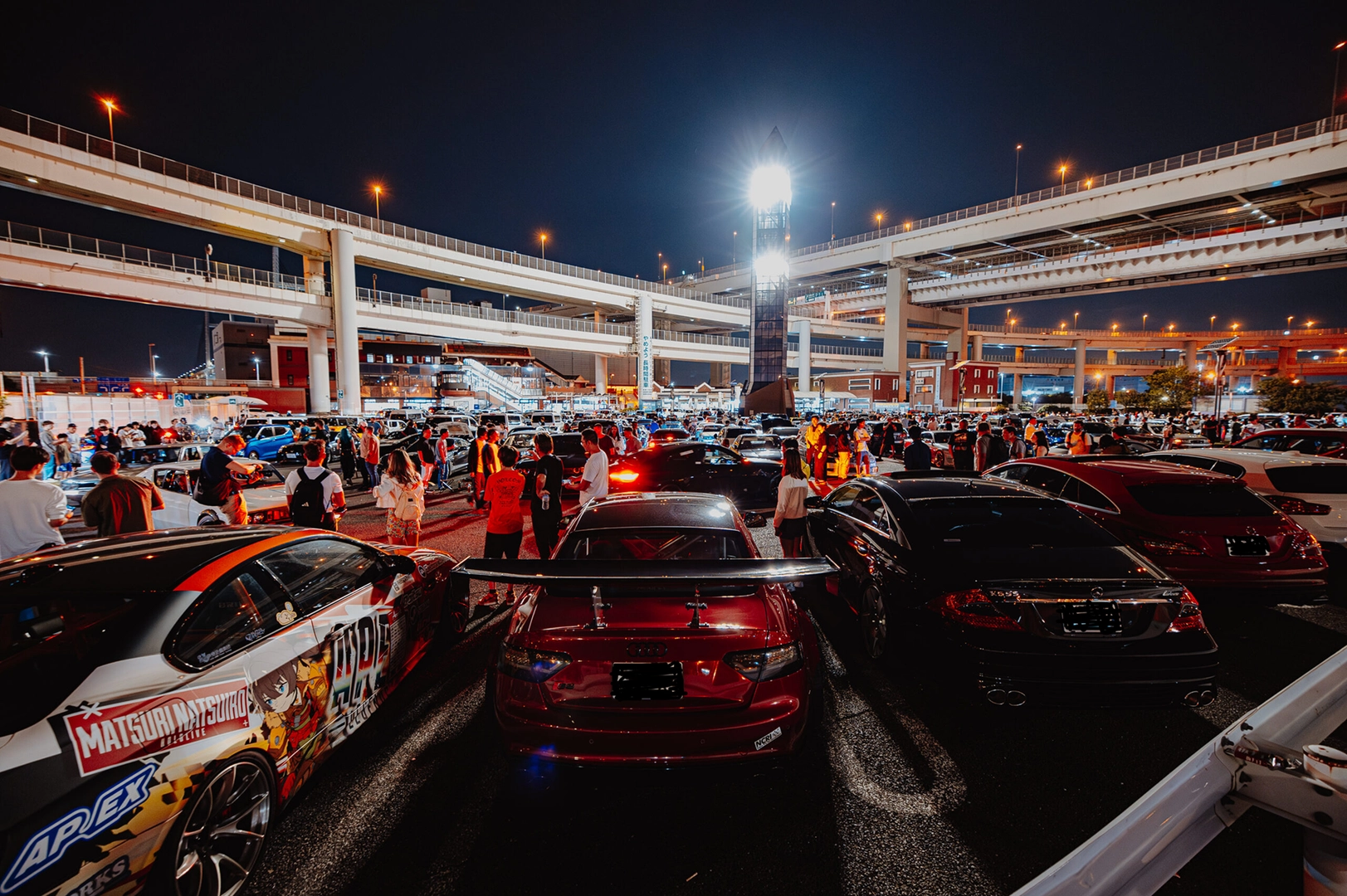 Daikoku PA parking area at night filled with Japanese performance cars